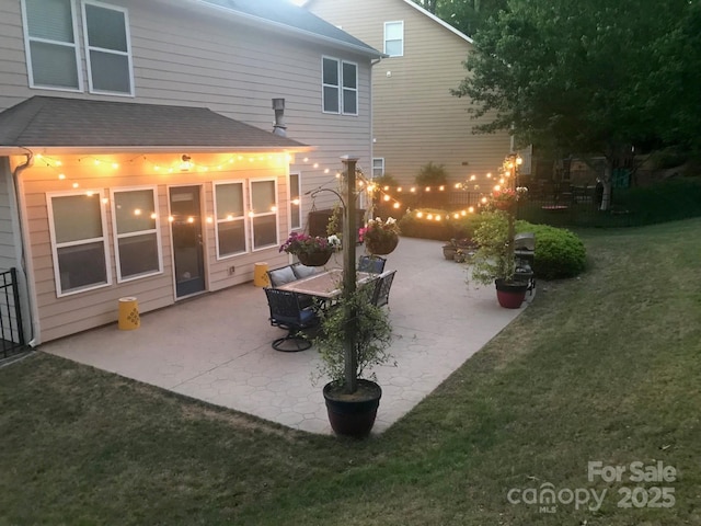 985 Angelica Ln, Tega Cay, SC 29708 - rear view of property featuring a lawn, roof with shingles, outdoor dining space, and a patio area
