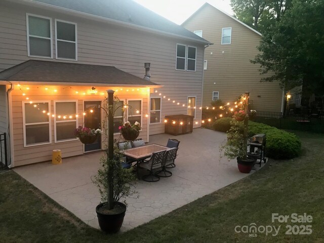 985 Angelica Ln, Tega Cay, SC 29708 - back of house featuring a hot tub, fence, a shingled roof, and a patio area