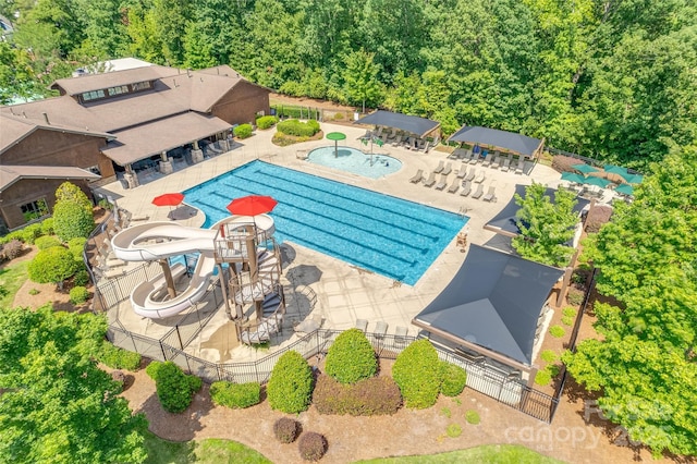 985 Angelica Ln, Tega Cay, SC 29708 - community pool with fence, a water slide, a patio area, and a water play area