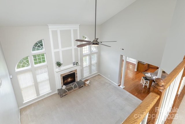 6941 Augustine Way, Charlotte, NC 28270 - living area with high vaulted ceiling, a lit fireplace, ceiling fan, and baseboards