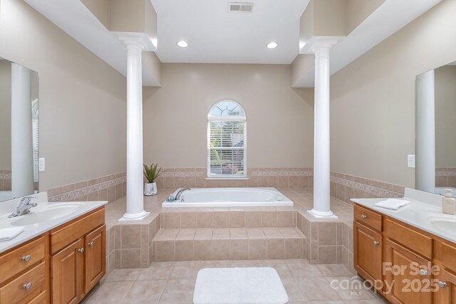 6941 Augustine Way, Charlotte, NC 28270 - bathroom featuring decorative columns, tile patterned flooring, a bath, vanity, and recessed lighting