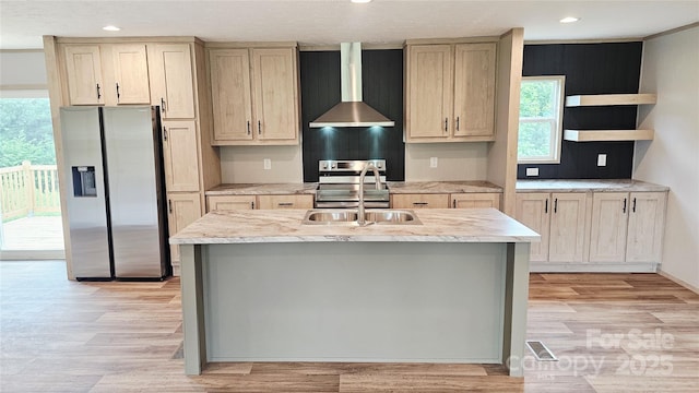 5989 Kaylas Ridge Rd, Connelly Springs, NC 28612 - kitchen with appliances with stainless steel finishes, wall chimney range hood, light wood-type flooring, recessed lighting, and a center island with sink