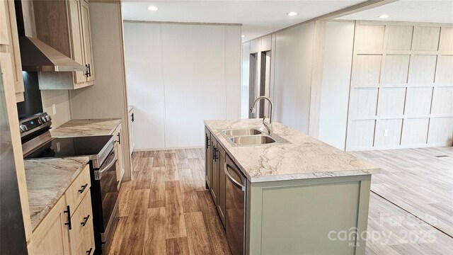 5989 Kaylas Ridge Rd, Connelly Springs, NC 28612 - kitchen with stainless steel appliances, light wood-type flooring, a center island with sink, recessed lighting, and under cabinet range hood