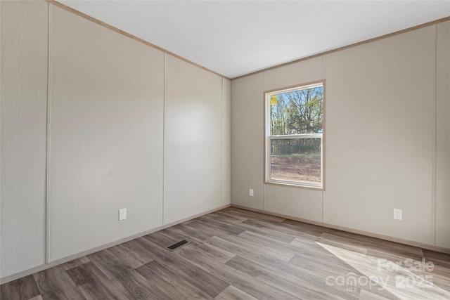 5989 Kaylas Ridge Rd, Connelly Springs, NC 28612 - spare room featuring wood finished floors and vaulted ceiling