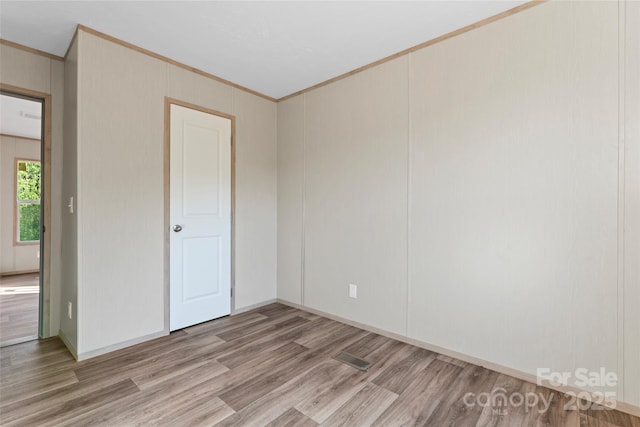 5989 Kaylas Ridge Rd, Connelly Springs, NC 28612 - spare room featuring ornamental molding and wood finished floors