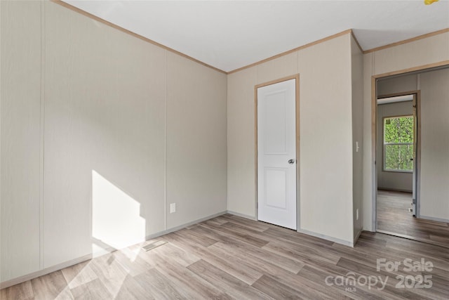 5989 Kaylas Ridge Rd, Connelly Springs, NC 28612 - unfurnished room with crown molding and light wood finished floors