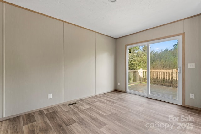 5989 Kaylas Ridge Rd, Connelly Springs, NC 28612 - spare room with light wood finished floors and ornamental molding