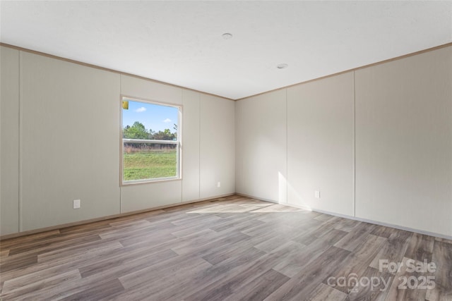5989 Kaylas Ridge Rd, Connelly Springs, NC 28612 - spare room with light wood finished floors and a decorative wall