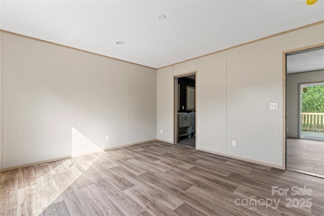 5989 Kaylas Ridge Rd, Connelly Springs, NC 28612 - spare room featuring wood finished floors and ornamental molding
