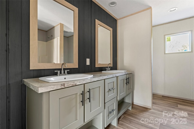5989 Kaylas Ridge Rd, Connelly Springs, NC 28612 - full bathroom with double vanity and wood finished floors