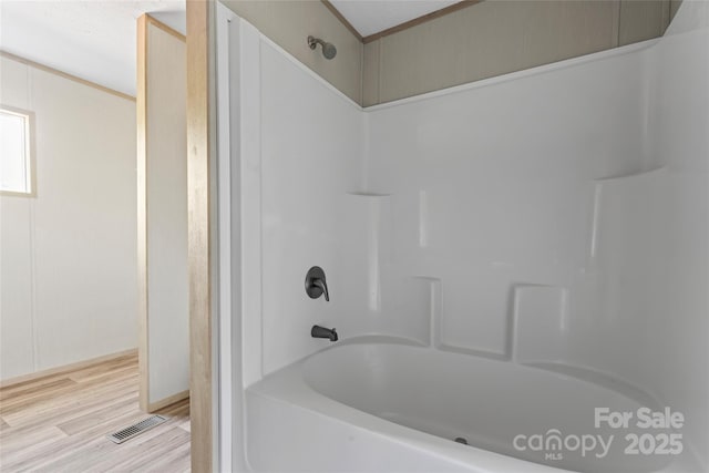 5989 Kaylas Ridge Rd, Connelly Springs, NC 28612 - full bathroom with washtub / shower combination and wood finished floors