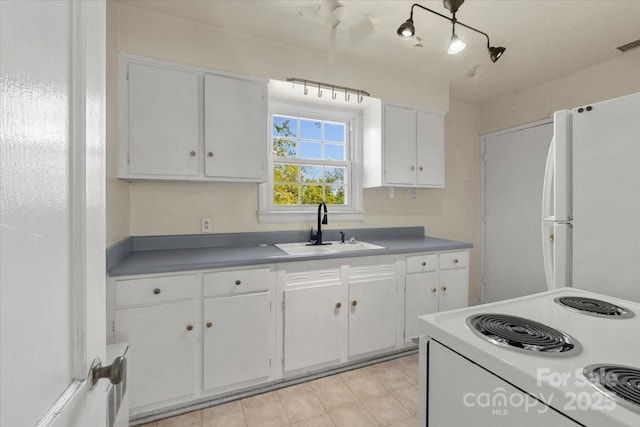 343 Wakefield Dr Unit C, Charlotte, NC 28209 - kitchen with white appliances, a sink, white cabinetry, and light countertops