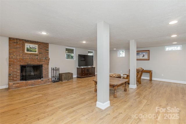 215 Shannon Rd, Hendersonville, NC 28791 - living room featuring light wood-type flooring, a fireplace, baseboards, and recessed lighting