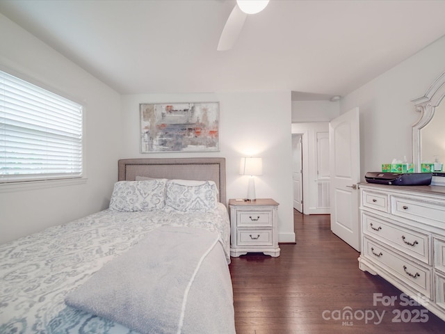 bedroom with dark wood-style floors and ceiling fan
