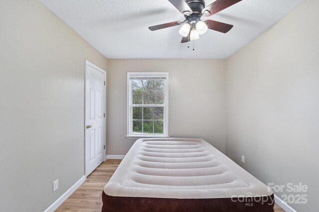 510 Laurel St, Hendersonville, NC 28792 - bedroom featuring light wood-style flooring, baseboards, and a ceiling fan