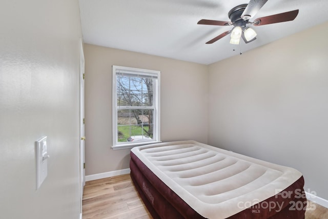 510 Laurel St, Hendersonville, NC 28792 - bedroom featuring baseboards, a ceiling fan, and light wood-style floors