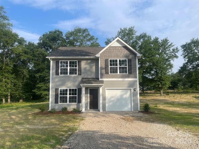 58 Simpson Rd, Pageland, SC 29728 - view of front of home featuring driveway, an attached garage, and roof with shingles