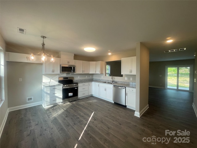 58 Simpson Rd, Pageland, SC 29728 - kitchen with appliances with stainless steel finishes, a sink, dark wood-style flooring, baseboards, and recessed lighting