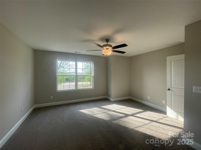 58 Simpson Rd, Pageland, SC 29728 - spare room with dark carpet, baseboards, and ceiling fan