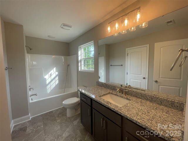 58 Simpson Rd, Pageland, SC 29728 - bathroom with vanity,  shower combination, toilet, marble look tiles, and baseboards