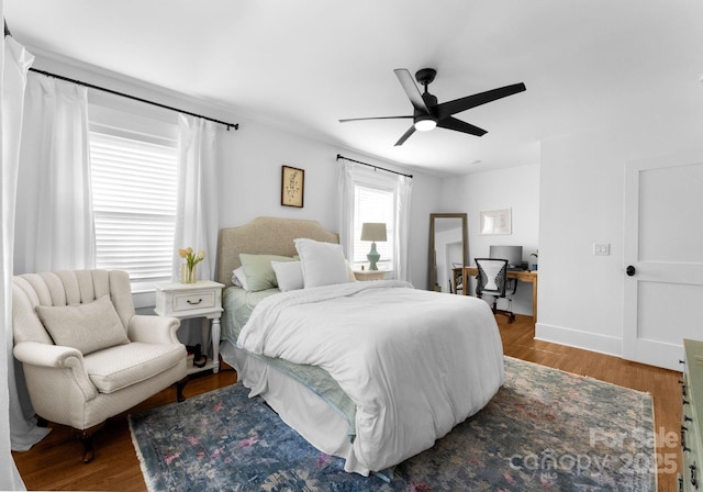 bedroom with wood finished floors and ceiling fan
