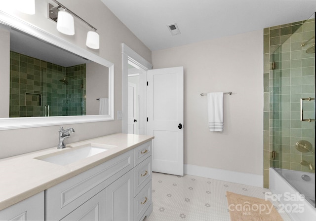 bathroom featuring tile patterned floors, visible vents, vanity, baseboards, and bath / shower combo with glass door