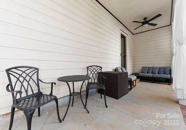 view of patio with ceiling fan and outdoor lounge area