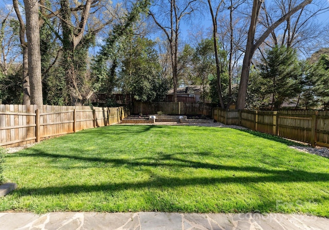 view of yard featuring a fenced backyard