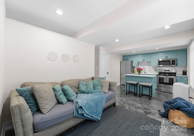 living room featuring recessed lighting and concrete floors
