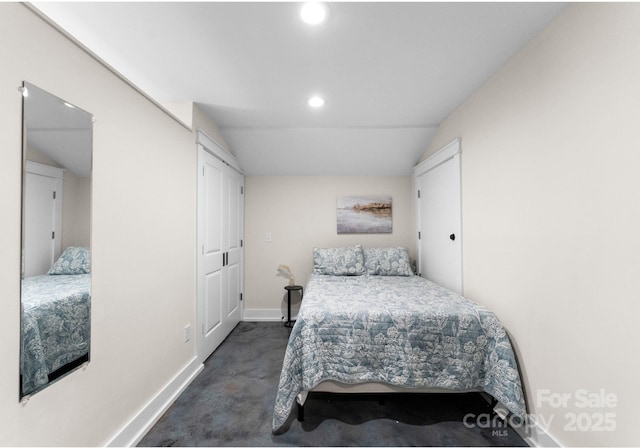 bedroom with baseboards, lofted ceiling, and recessed lighting