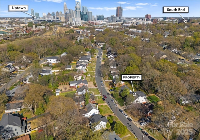 drone / aerial view featuring a city view