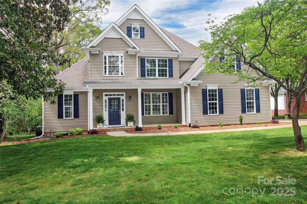 312 Peach St, Shelby, NC 28150 - view of front of property featuring a front lawn and a shingled roof