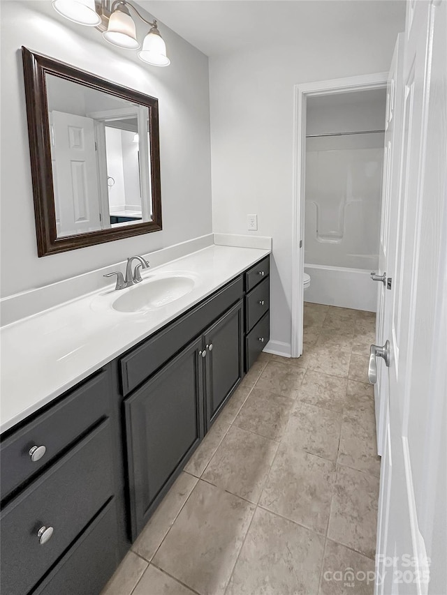 bathroom featuring tile patterned floors, toilet, vanity, and shower / bath combination