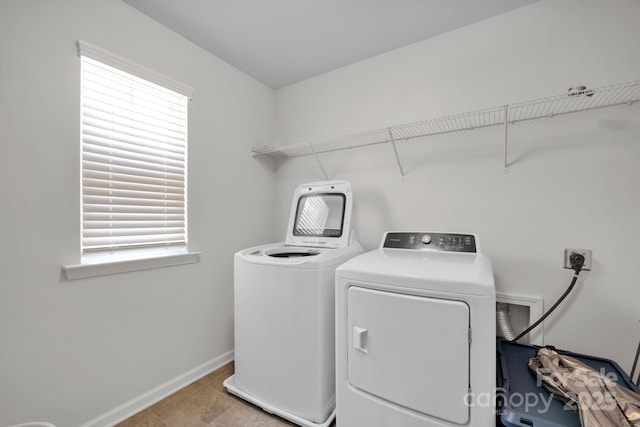 15127 Oleander Dr, Charlotte, NC 28278 - laundry room with a wealth of natural light, washing machine and dryer, laundry area, and baseboards