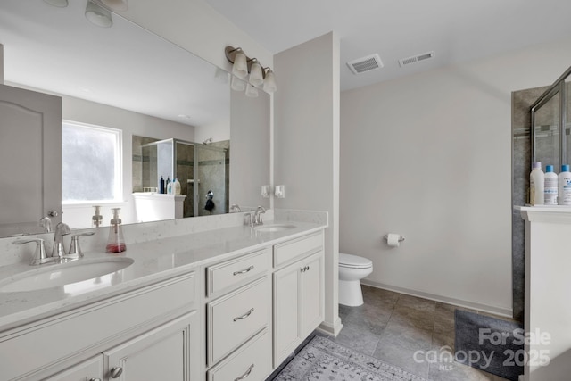 15127 Oleander Dr, Charlotte, NC 28278 - bathroom with double vanity, visible vents, a sink, and a stall shower