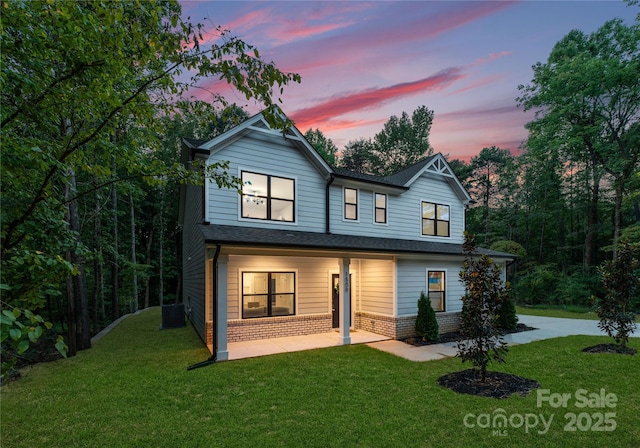 6524 Robert St, Huntersville, NC 28078 - back of property with central AC, brick siding, a yard, and a patio