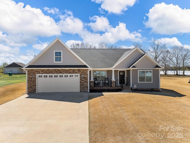218 Little Man Dr, Boiling Springs, SC 29316 - craftsman-style house featuring a porch, concrete driveway, a garage, and a front lawn