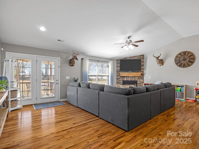 218 Little Man Dr, Boiling Springs, SC 29316 - living room with visible vents, ceiling fan, a fireplace, wood finished floors, and lofted ceiling