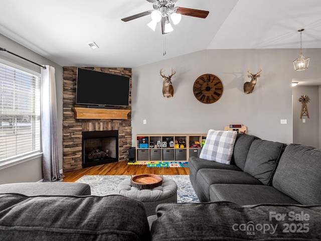218 Little Man Dr, Boiling Springs, SC 29316 - living area featuring a stone fireplace, ceiling fan, wood finished floors, and lofted ceiling