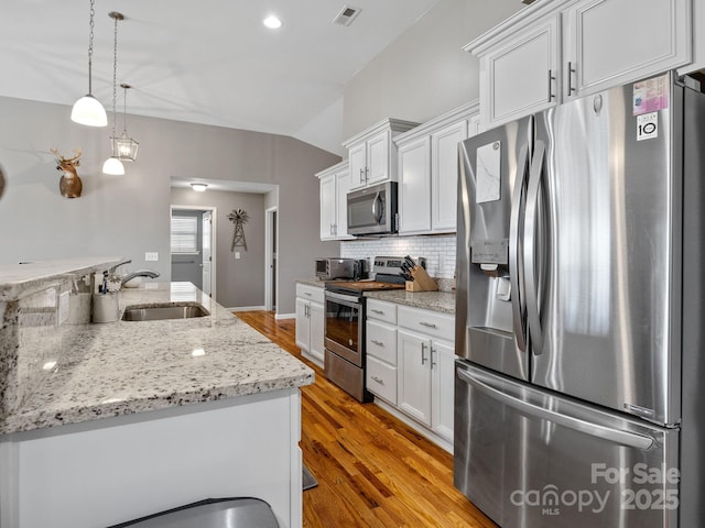 218 Little Man Dr, Boiling Springs, SC 29316 - kitchen featuring visible vents, white cabinets, a sink, stainless steel appliances, and light wood-style flooring