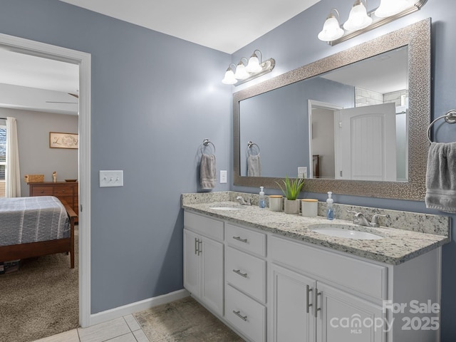 218 Little Man Dr, Boiling Springs, SC 29316 - ensuite bathroom featuring double vanity, a sink, tile patterned flooring, and connected bathroom