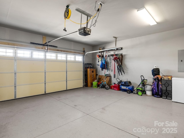 218 Little Man Dr, Boiling Springs, SC 29316 - garage with a garage door opener, fridge, and electric panel