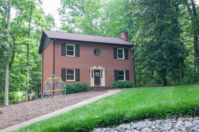 2540 Heritage Cir, Statesville, NC 28625 - colonial-style house featuring a chimney and brick siding