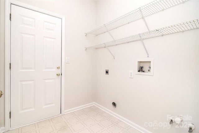 washroom featuring washer hookup, laundry area, baseboards, electric dryer hookup, and light floors