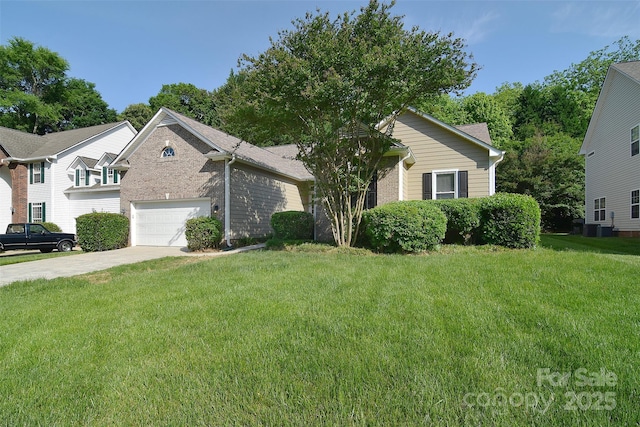 view of front of property featuring brick siding, central AC, driveway, and a front yard