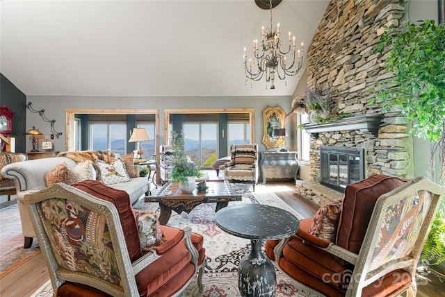 704 Fleetwood Plz, Hendersonville, NC 28739 - living area featuring wood finished floors, lofted ceiling, a chandelier, and a fireplace