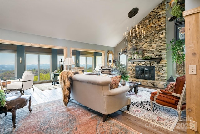 704 Fleetwood Plz, Hendersonville, NC 28739 - living room with hardwood / wood-style floors, a stone fireplace, and high vaulted ceiling