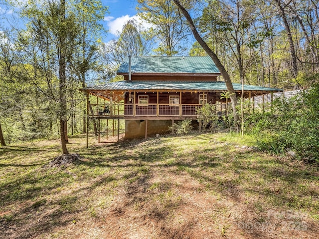 147 Cove Hollow Rd, Rutherfordton, NC 28139 - back of property with a lawn, covered porch, and metal roof