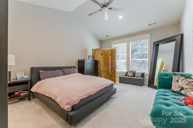 bedroom with lofted ceiling, visible vents, ceiling fan, and light carpet