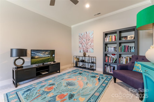 living area with baseboards, ornamental molding, carpet flooring, and visible vents
